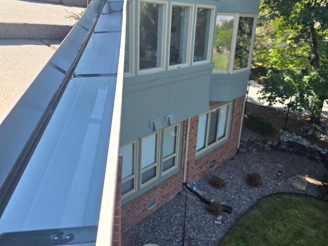 Clean gutters on a residential roof in Boulder