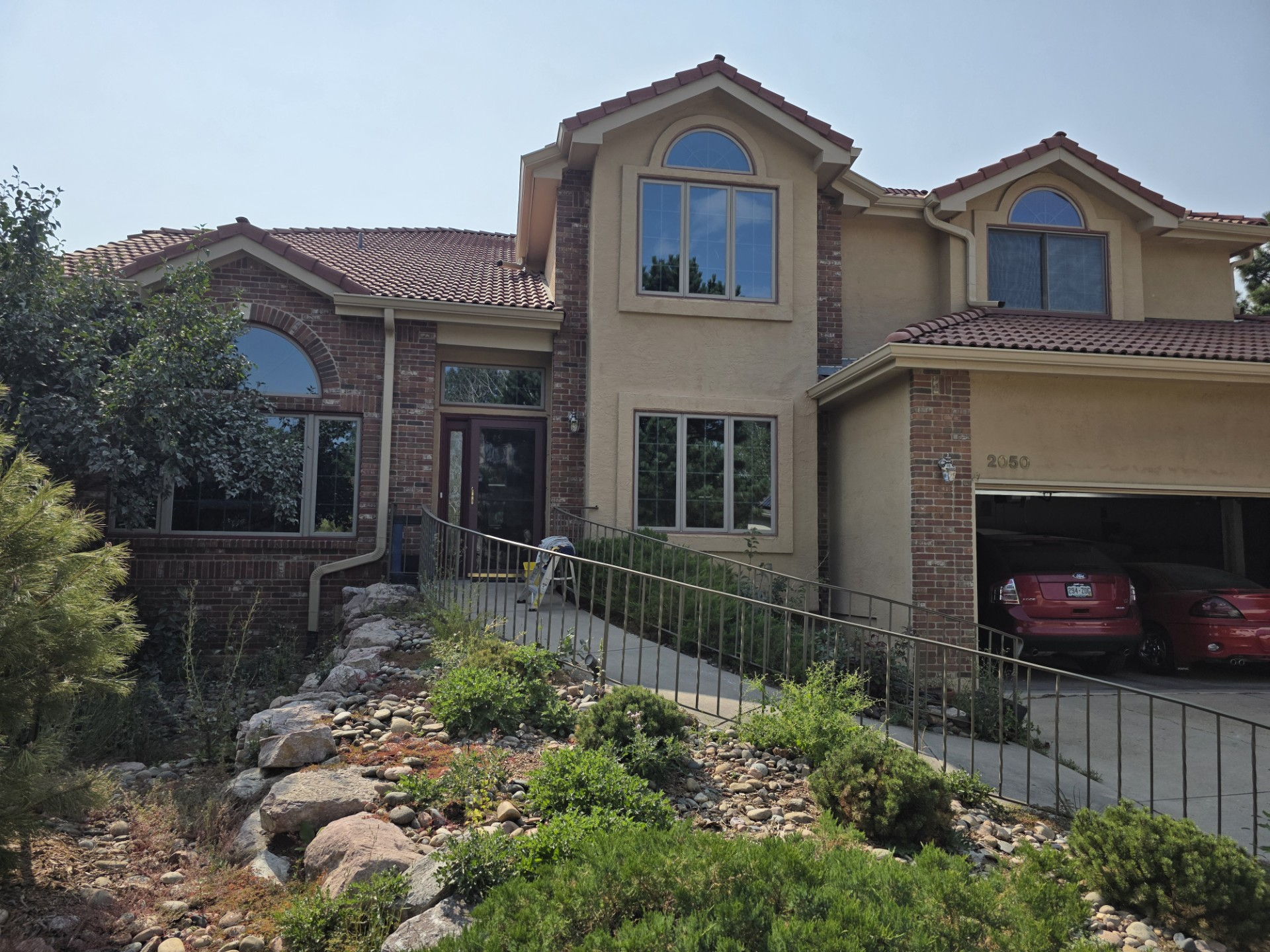 Pressure washing in progress on a driveway in Boulder CO